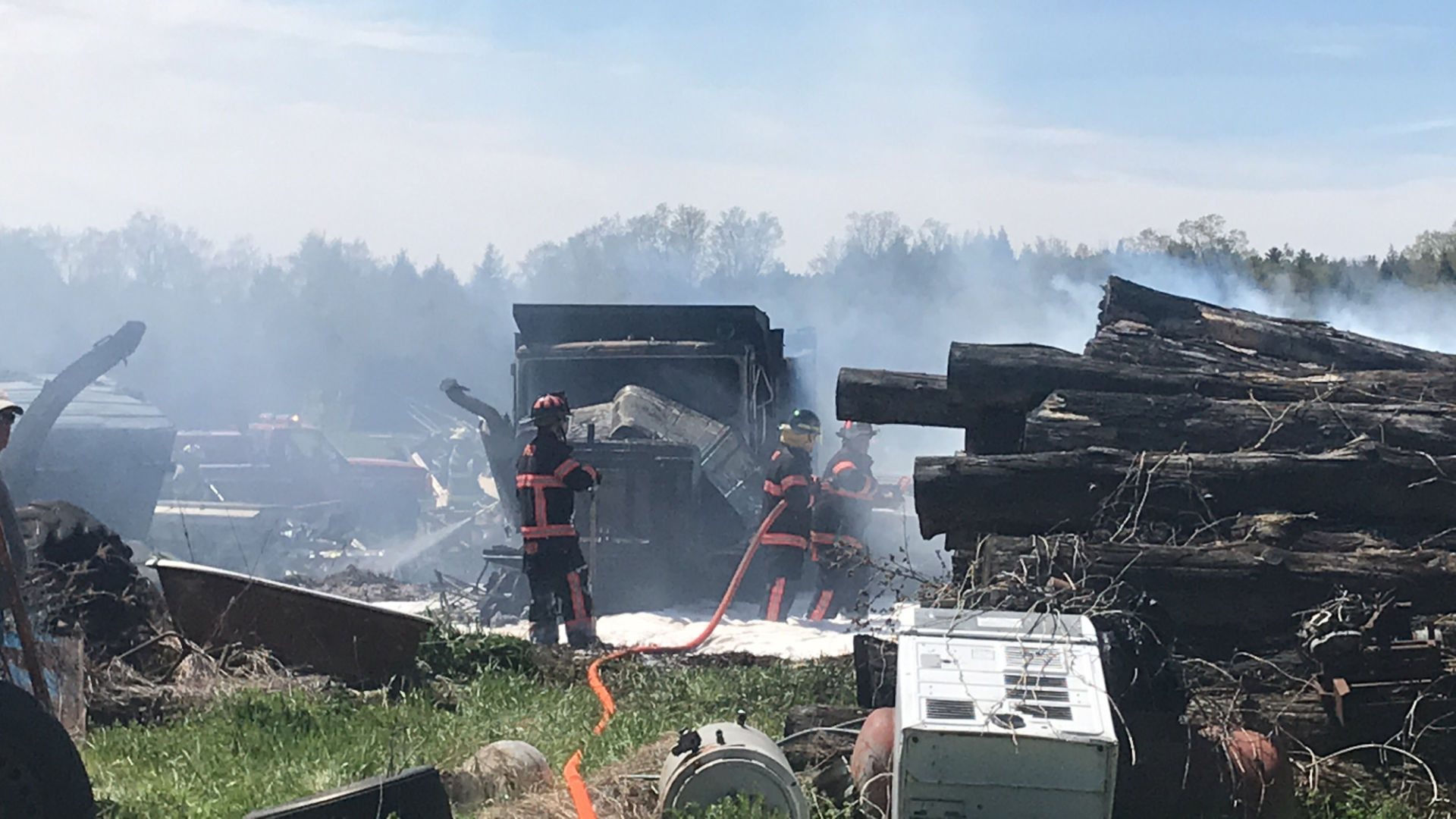 Norwood grass fire spreads, burns truck, car